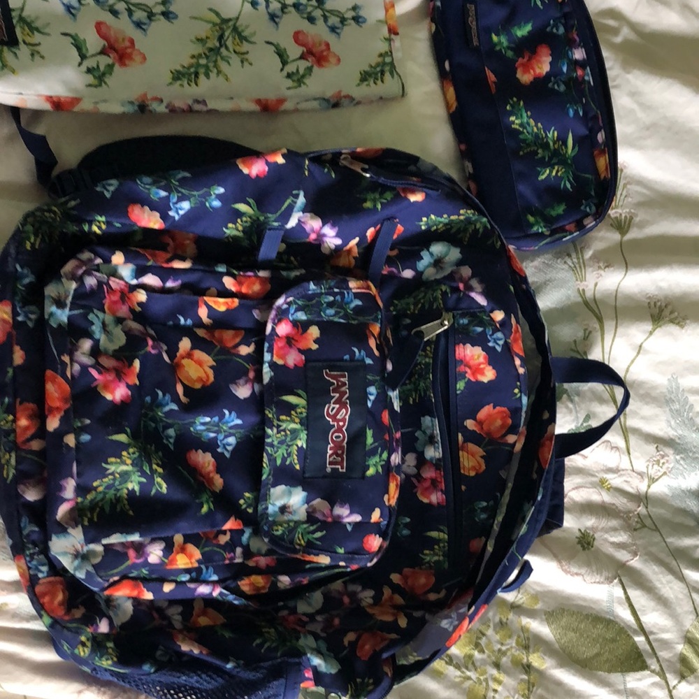 Jansport floral backpack with laptop sleeve and electronic pouch/pencil case.